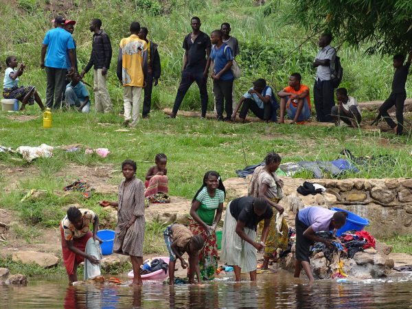 06 On the other river bank women from Kandale village clean clothes in the river